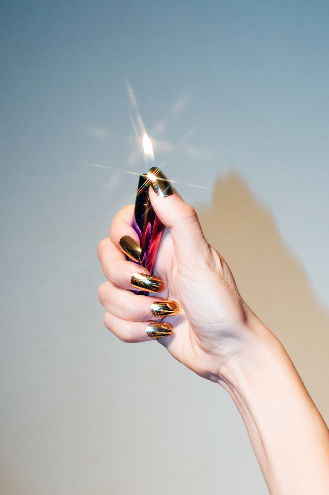Hand holding a lighter